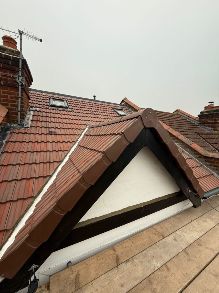 White fascias and soffits on a tiled gable by Aulakh Roofing
