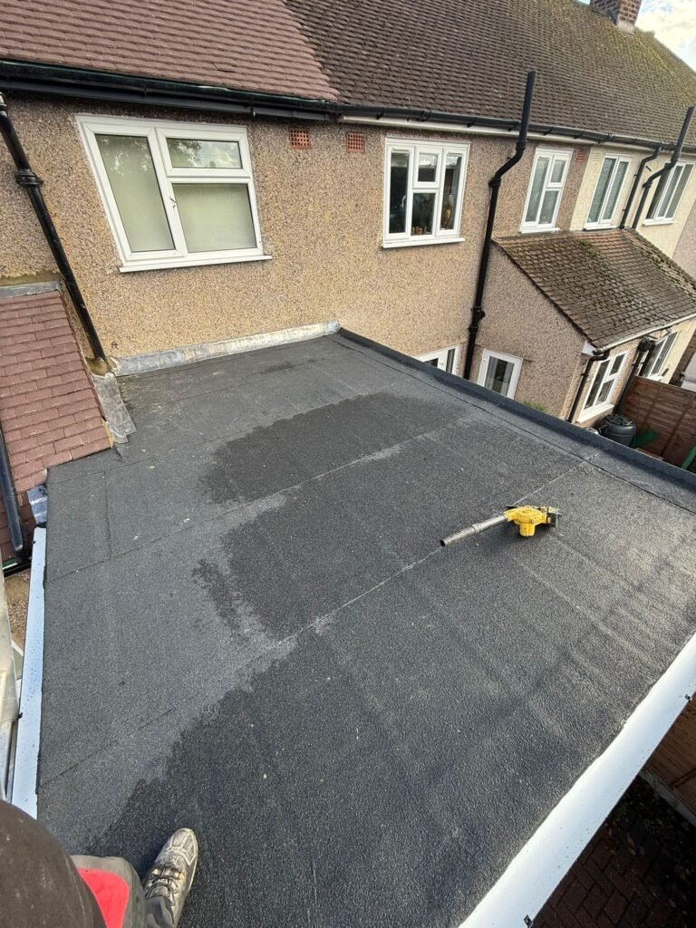 Flat roof installation in progress by Aulakh Roofing