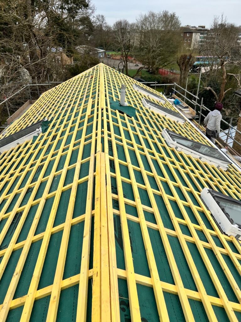 New battens over breathable membrane during an Aulakh re-roof