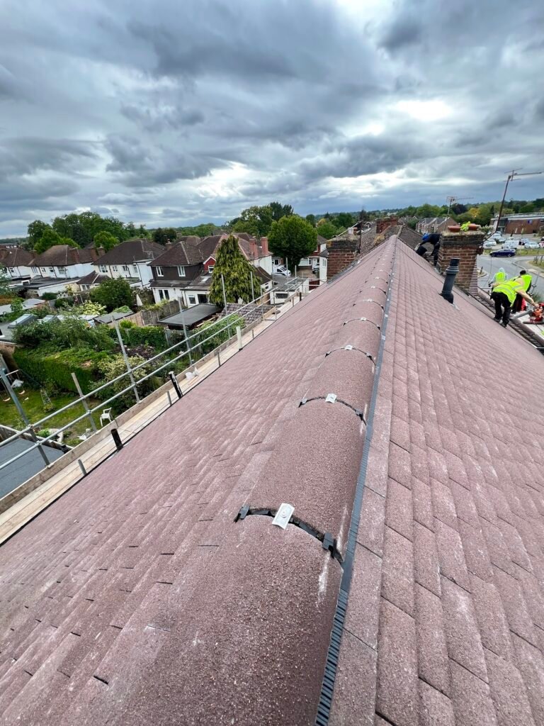 Brown tiled pitched roof with ridge line viewed from the roof in Hounslow