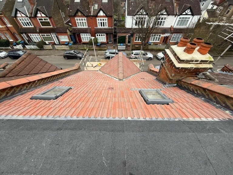 Clay tile roof with roof windows by Aulakh Roofing