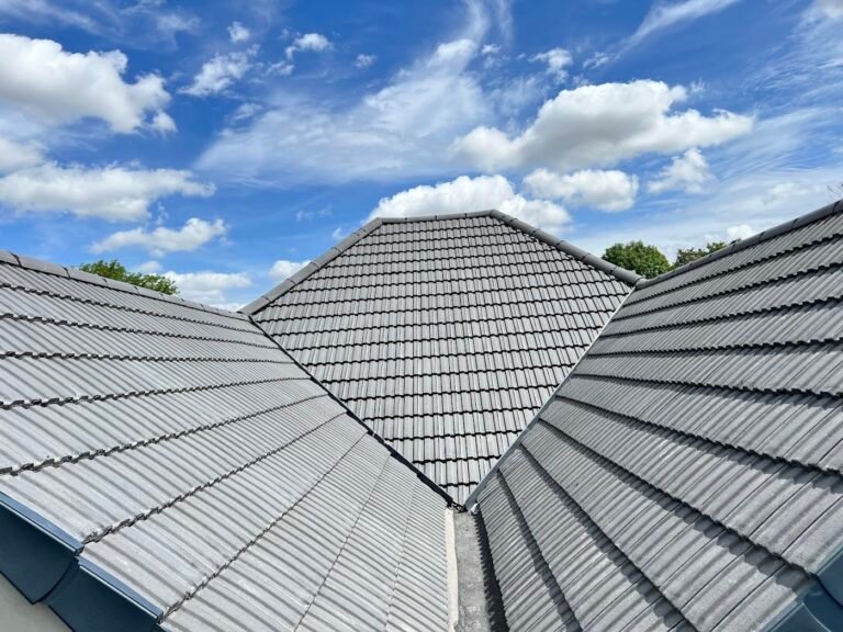Grey tiled hip roof fitted by Aulakh Roofing, West London