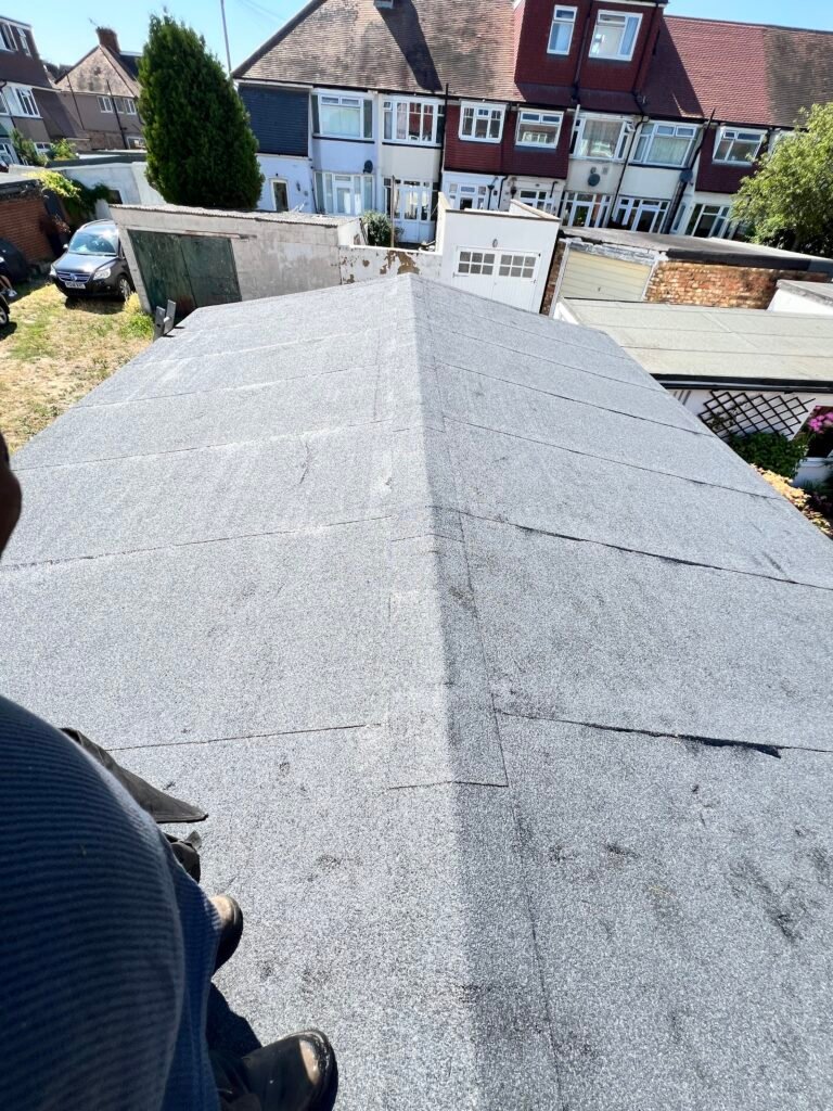 Grey mineral felt roof on a garage, finished by Aulakh Roofing in Hounslow
