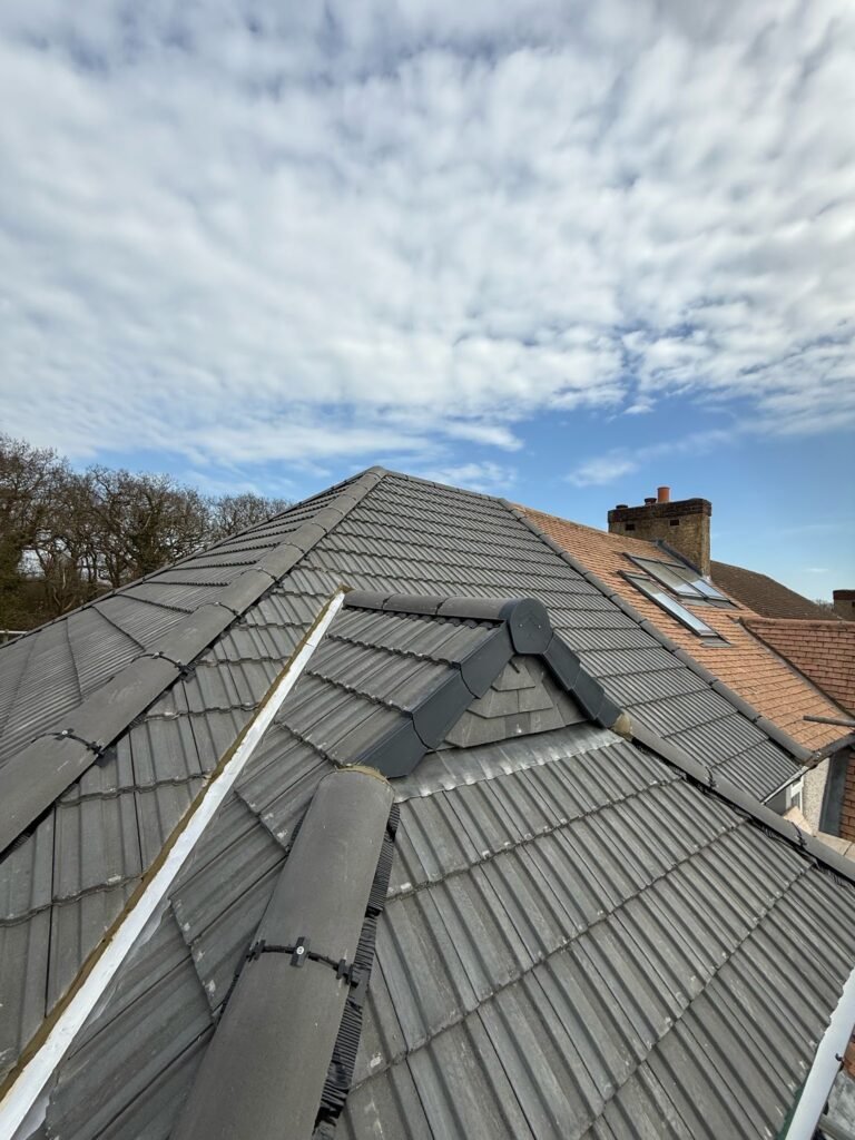 Roof replacement with ridge tiles by Aulakh Roofing