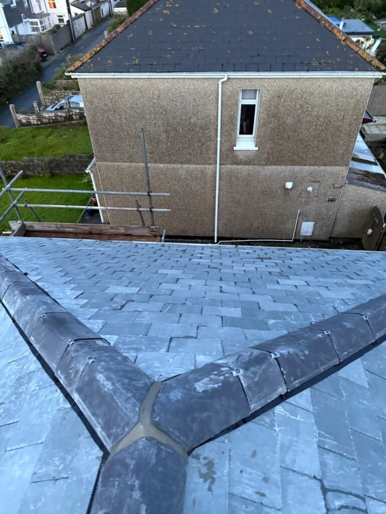Slate roof with hip ridges viewed from above in Hounslow